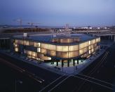 The California DataMart by Tanner & VanDine Architects (now TannerHecht) glows at night, like the computer monitors once on display there.