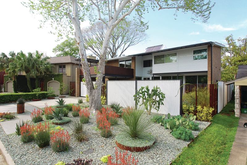 The landscaping at Karen Lantz’s Houston house is irrigated using a below-ground water collection tank manufactured by Norwesco in St. Bonifacius, Minn.