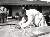 A Taliesen fellow in Chandler, Ariz., works on a 1935 model of Wright’s Broadacre City development scheme, which sought to bring urban density to suburbia. 