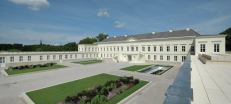 In the courtyard, parterres have been removed to accommodate light wells for the conference level below.