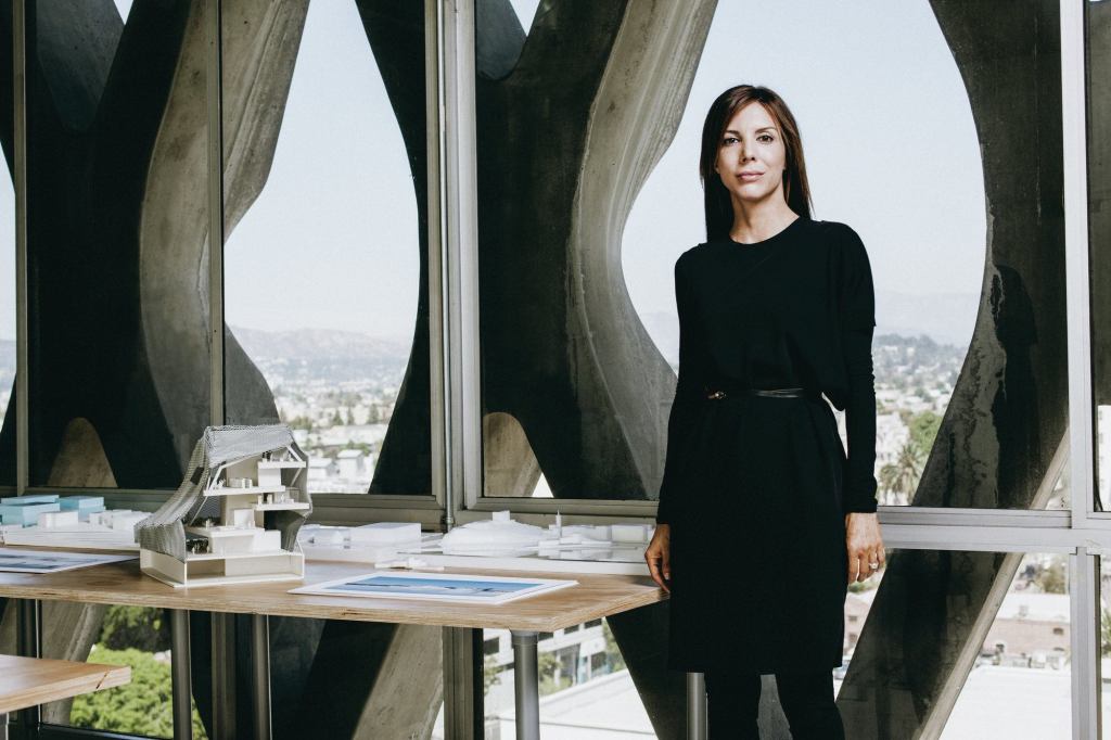 Jennifer Marmon stands beside a section model for PAR’s Helsinki Central Library proposal. The firm collaborated with Arup on a highly technical, transparent façade with thermal properties.
