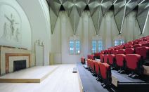 The aluminum mesh screens were sized and cut on-site to ensure its grid-based support framing looked in line with the existing space’s non-parallel sidewalls.