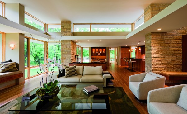 The main feature of this contemporary residential home is clear: its windows. The large amount of windows allow the passerby to appreciate the expertly arranged interior -- allowing the interior and exterior of the home to intermingle.