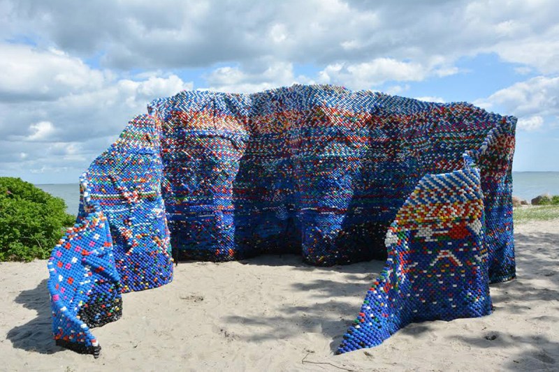 Artist Arunkumar H G created the&nbsp;installation "Droppings and the Dam(n)" out of more than 70,000 bottle caps collected over a year to comment on how disposable and wasteful lifestyles create unhealthy environments. Sited in Aarhus, Denmark, the artwork is part of the "Sculpture by the Sea" exhibition.