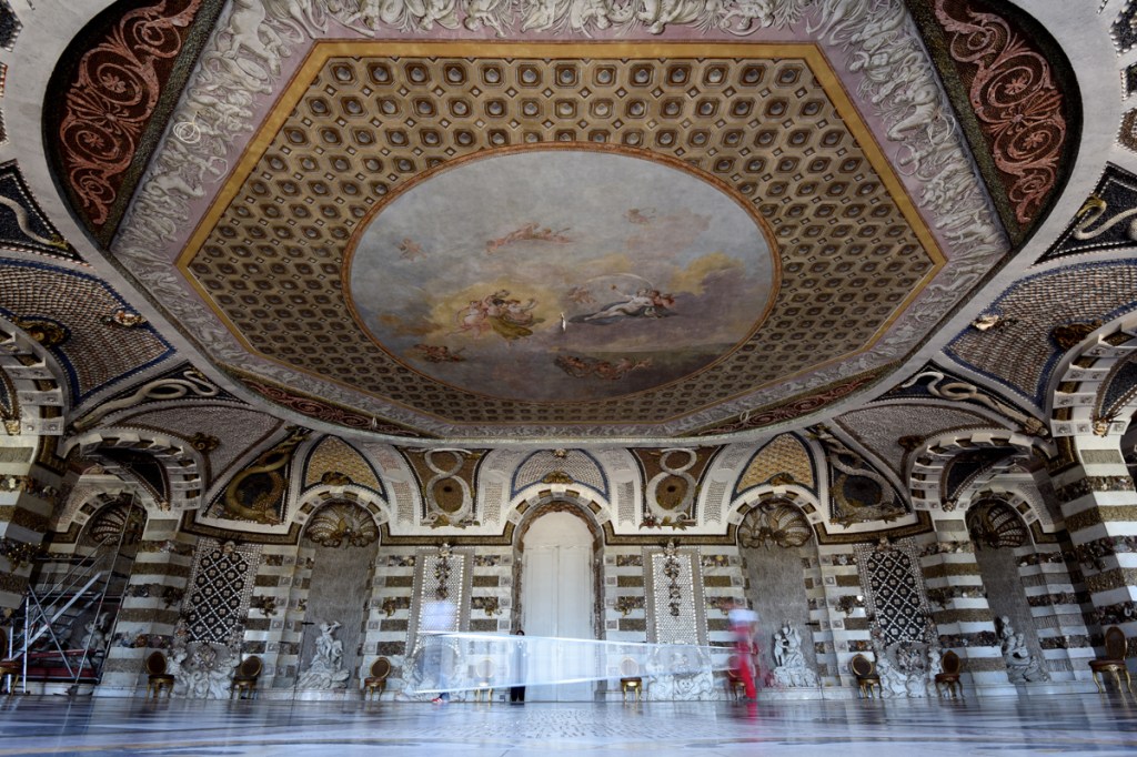 Two men walk through the Grotto Hall ("Grottensaal") of the 18th-century UNESCO World Heritage Site New Palace in Potsdam, Germany. After restoration work that lasted several years and cost several million euros, the hall reopens today.