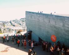 Attendees gathered outside a symposium break.