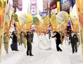 The communal "ring" formed by the heart-shaped mirrors can host public gatherings, such as weddings or performances. As evident from this rendering, lots of colorful characters show up to Collective-LOK's installation, such as the llama on the left, and the infamous Naked Cowboy seen behind the second construction from the right.