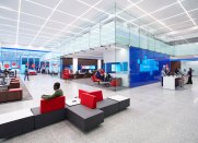 3500K was selected as the color temperature for all the fixtures to support the bank's blue corporate color scheme and the material palette that includes warm wood tones.