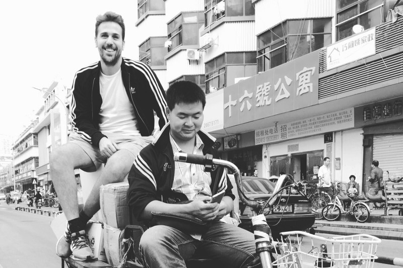 Giovanni (left) rides around Shenzhen collecting items for the 2015 Shenzhen Hong Kong Bi-City Biennale.
