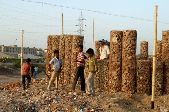 Students help construct the gabion walls of the Patangyu School in Ahmedabad, India.