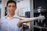 NTU assistant professor Yang En-Hua, holding the bendable concrete his team invented.