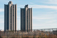 More than 150 multifamily projects were constructed under the 1955 Mitchell- Lama housing program, including the Tracey Towers in the Bronx, N.Y. This project only exemplifies the type and age of buildings that may be included in the RetrofitNY initiative; no specific list of RetrofitNY projects was available at the time of this article's publication.