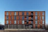 The south façade incorporates three shared balconies.