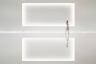 A recessed screen surface is softly framed by a carefully detailed knife-edge cove, hiding the light source from view even at the shallowest viewing angles.
