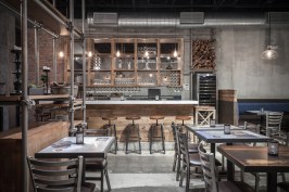 The 80-person restaurant features dining area, pizza bar, wine bar and wine cellar.