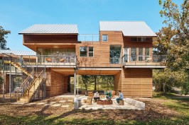 This 2,900-square-foot vacation residence in New Braunfels, Texas, is designed to accommodate a multigenerational family and leverage views of the nearby Guadalupe River.
