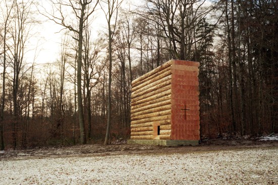 View from east, showing Douglas fir log walls on concrete plinth