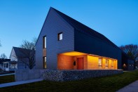 Cement-fiber lap siding conceals Zip System sheathing from Huber.