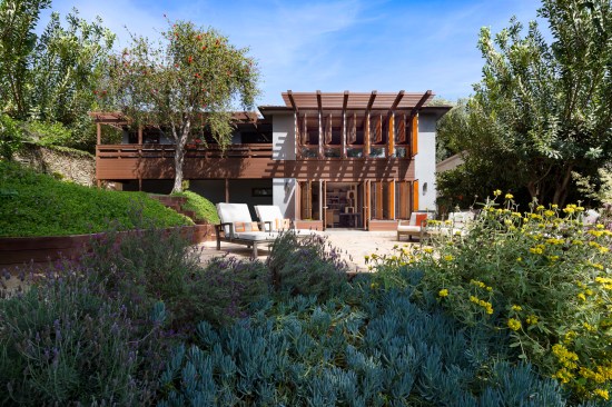 Rear view of the house featuring custom shade fins.