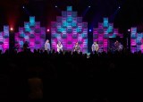 The stage design team at Blue Ridge Community Church created a versatile luminous wall using translucent ceiling panels that were illuminated from the rear. The top of each section was tapered to suggest the shape of cathedral arches. The wall, in the main sanctuary, was 18 feet tall at the center, yet very lightweight.