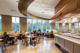 The new dining commons at Mount Holyoke College combines three styles of thermoformed ceiling panels plus mineral fiber panels to create visual scale and flow throught the large hall. Despite the acoustically live hard surfaces and noise from the exposed kitchen, the space has good sound control, thanks in part to the noise-reducing properties of the ceiling panels, enhanced with SonicGuard acoustic blankets above the thermoformed panels.