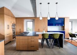 The kitchen was reimagined to improve storage, enhance flow, and provide seamless connection for gatherings in the living and dining areas.