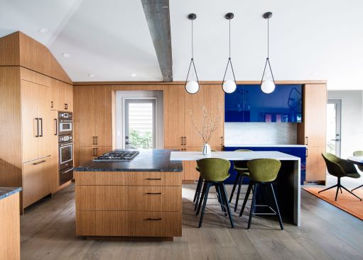 The kitchen was reimagined to improve storage, enhance flow, and provide seamless connection for gatherings in the living and dining areas.
