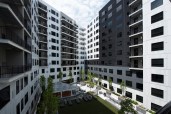 A mix of flush and corrugated metal panels in black, white and grey provides a sophisticated façade to the SkyVue Apartments in Pittsburgh. Photo: hortonphotoinc.com