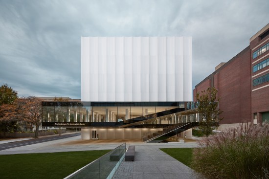 Building identity signage integrated into the glass curtain wall