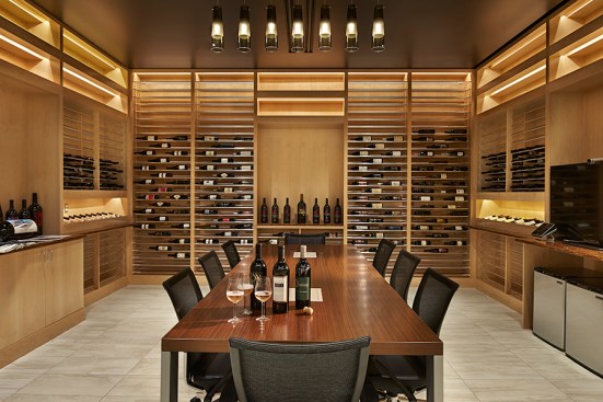 The Library/Tasting Room features 3,000 bottles of the world’s finest wine within a glossy red enclosure; reminiscent of its contents.
