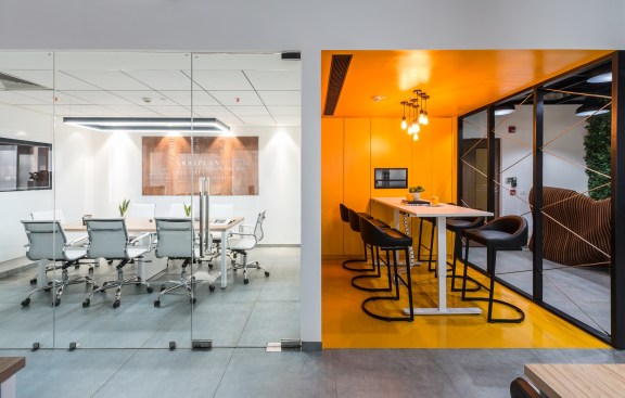 Both the meeting rooms with their distinct language and elements present a dynamic chemistry of contrasting variables