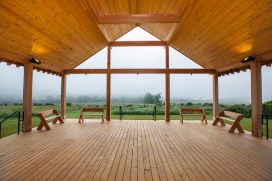 The building is highly responsive to the surrounding landscape in scale, materials, and site positioning