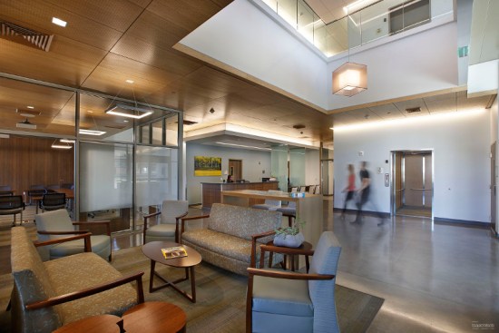Reception and check-in areas are announced by outcropped ceilings. Patients enjoy a concierge experience with high-quality, hospitality-themed materials.