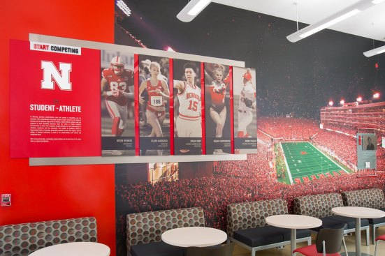 Start Competing 
The College of Business is also a key recruiting tool for Nebraska’s athletic program. This display shows five athletes – each in different sports – who are exemplary business students in addition to standout athletes. 
