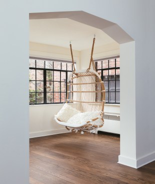 Rattan swing in the sunroom