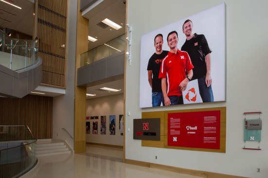 Start Something
Greeting visitors upon entry in the Henrickson Grand Atrium is a 14-foot tall display featuring the founders of HUDL, a leading software company aiding football coaches in evaluation and preparation. These three recent graduates of the University of Nebraska show the entrepreneurial tradition of the program using the example of alumni who followed their passions to start a cutting-edge business. 
