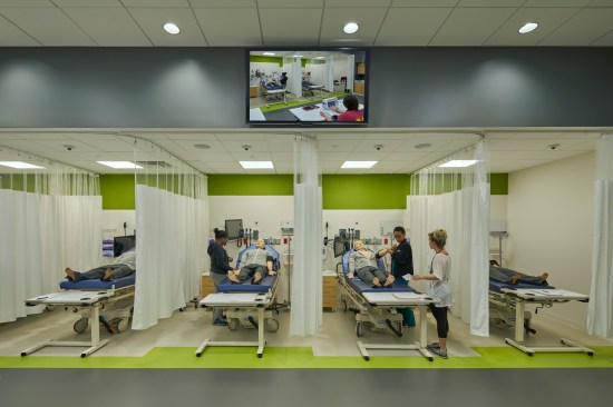 Students simulating real-world clinical situations with special mannequins in Skill Lab