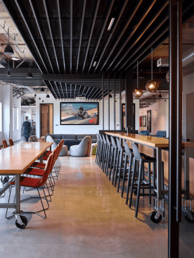 Highly flexible communal spaces feature movable furniture for maximum adaptability.