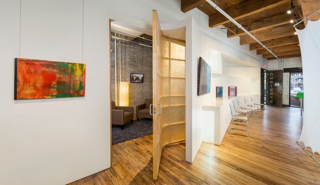 View into office behind unique swiveling door in flexible chiropractor's office