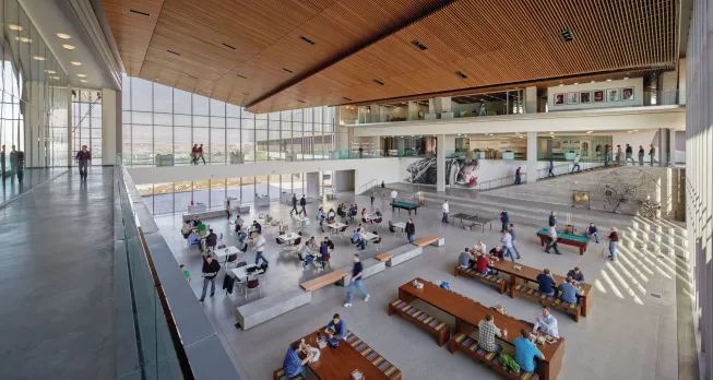 Ping-pong tables give an open cafeteria a youthful edge; communal tables promote group interaction well after lunch hour.