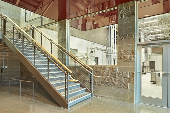 Masonry walls are rough and cold to the touch; enhancing the perception that the lower level of the building is the “roots” where the actual wine making takes place.