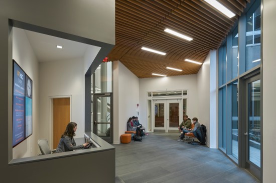 Reception desk at connector between campus buildings.