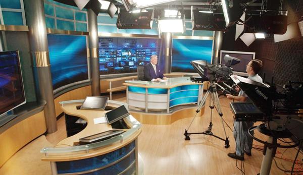 The newspaper is not the only tenant in the building. The local news channel, SNN Channel 6, has a blackbox studio from which they broadcast the nightly news. The inclusion of the soundstage in the building allows ready access to the newsrooms and research departments for the evening's stories.