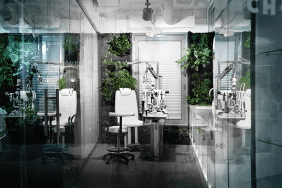 A+green+wall%e2%80%93lined+exam+room+allows+the+staff+to+perform+ophthalmological+tests+within+the+confines+of+their+new+office+space.