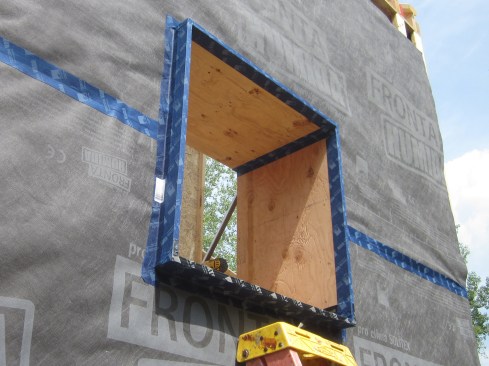 Figure 14. We used 3/4" CDX for the window bucks rather than OSB. I believe plywood is more resilient against water damage and slightly more vapor open than OSB. The bucks are sealed to the WRB with the Tescon Vana tape. We also tape the inside corners of the buck (for more info on buck installation and air-sealing, see Chris West’s blog on window detailing).