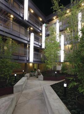 The courtyard provides a place of sanctuary for the special-needs residents. Floating light fixtures add to the contemplative, otherworldly feeling.