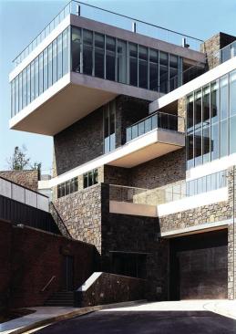 The masonry walls of the new Marriott Hall were designed to match those of the original 1909 school building as much as possible. Since the original quarry was long-closed, the team selected stone?based on a color match?from White Hall, N.Y., in the Adirondack Mountains, and they executed several mock-ups to ensure that the mortar work had the same hand-tooled raking as the original. The design team selected darker stone to act as a sort of wainscoting where the building meets the ground plane, another homage to the original building.