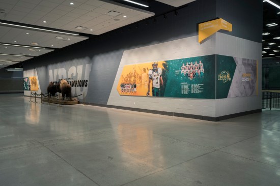 Wall covering graphics recognize current and former student-athletes and their accolades