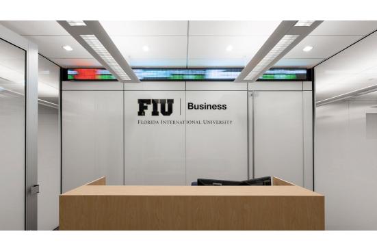LEVELe Wall System with Blind panels; insets in ViviGraphix Spectra glass with custom pattern interlayer and Standard finish, ViviChrome Chromis glass with White interlayer and Standard finish; door with stiles and rails in Stainless Steel with Sandstone finish, inset in ViviGraphix Gradiance glass with Scatter interlayer and Standard finish at Florida International University - Ryder School of Business, Media Labs, Miami, Florida