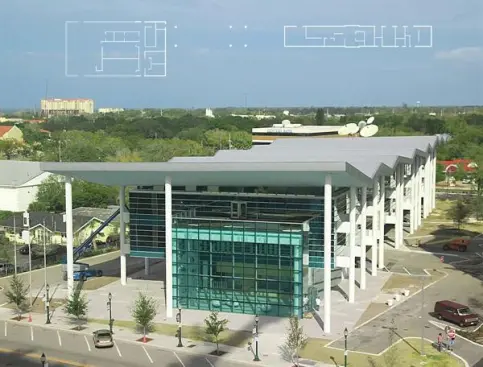 The creased roof of the Sarasota Herald Tribune headquarters is the building's signature. The design takes advantage of the local climate by integrating a deck accessible from the newsroom and by cladding the building in glass, so the sunlight can illuminate the interior during the day. Galvalume standing-seam roof - Morrell Sheet Metal 55-percent aluminum, zinc-alloy coated sheet steel - Vertical seams stand 90 degrees from the roof surface - Seams usually occur every 18-24 inches but can be custom set Single-ply PVC membrane - Sika Sarnafil - www.sarnafilus.com Fiberglass-reinforced membrane - Can withstand long-term exposure to the elements - Lacquer coating resists staining from airborne pollutants - Vapor permeable - Available in six standard and custom colors - Comes in 6.5- foot- and 10-foot-wide rolls